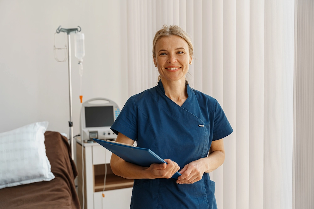 Experienced medical tech holding a patient's chart.