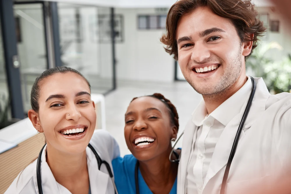 Smiling travel healthcare team working a weekend shift.