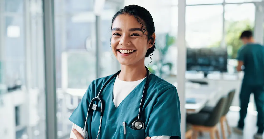 Smiling CT Technologist at a medical facility.